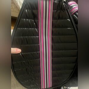 The zippered racket part of a pickleball bag set.